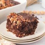 Slice of German Chocolate Dump Cake on a white plate.