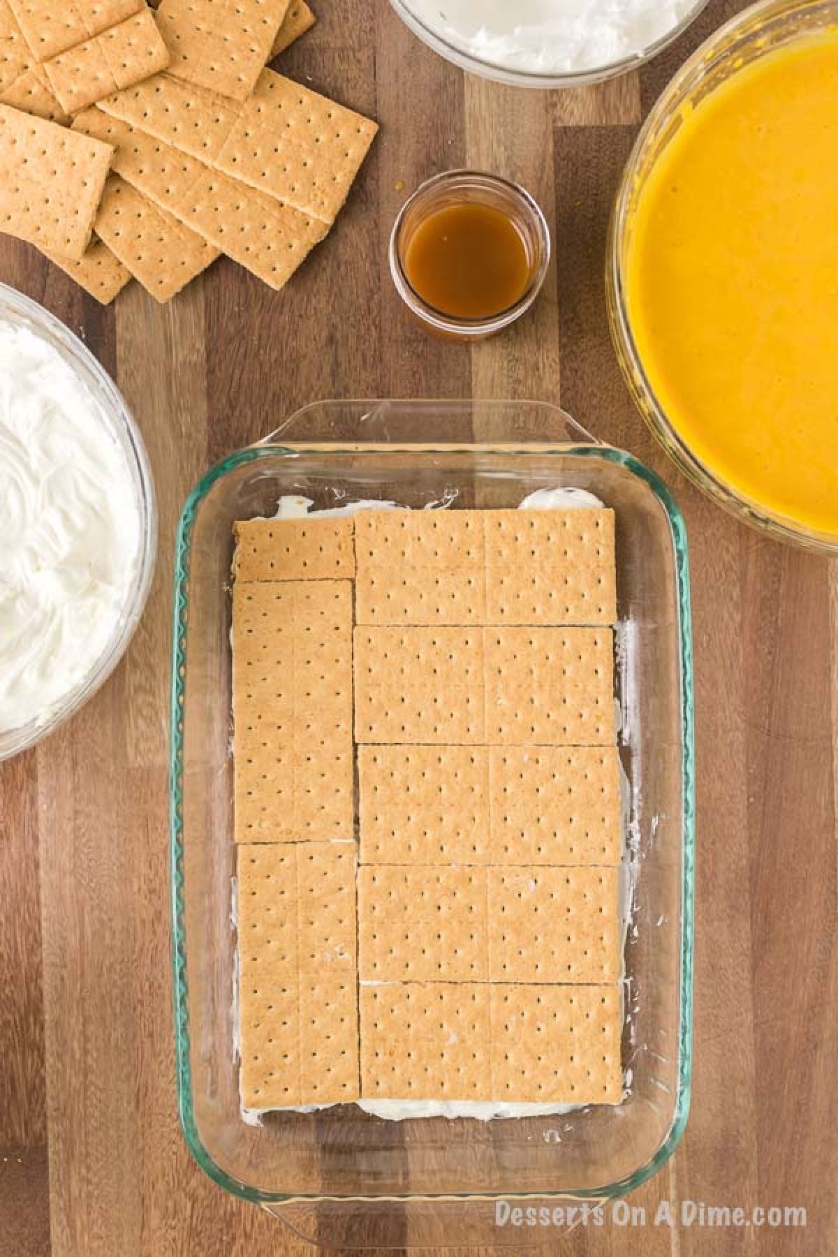 The cream cheese mixture spread into the bottom of a 9X13 pan with the graham crackers layered on top.  