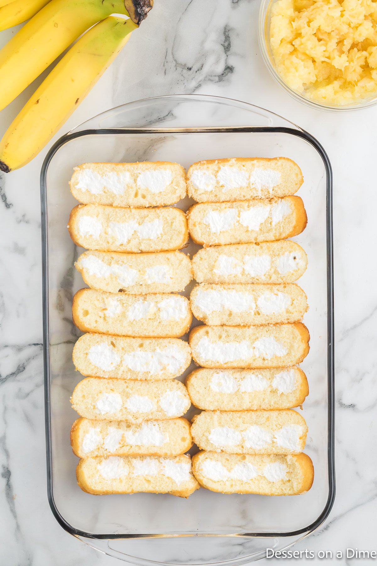 Twinkies cream side up in baking dish.