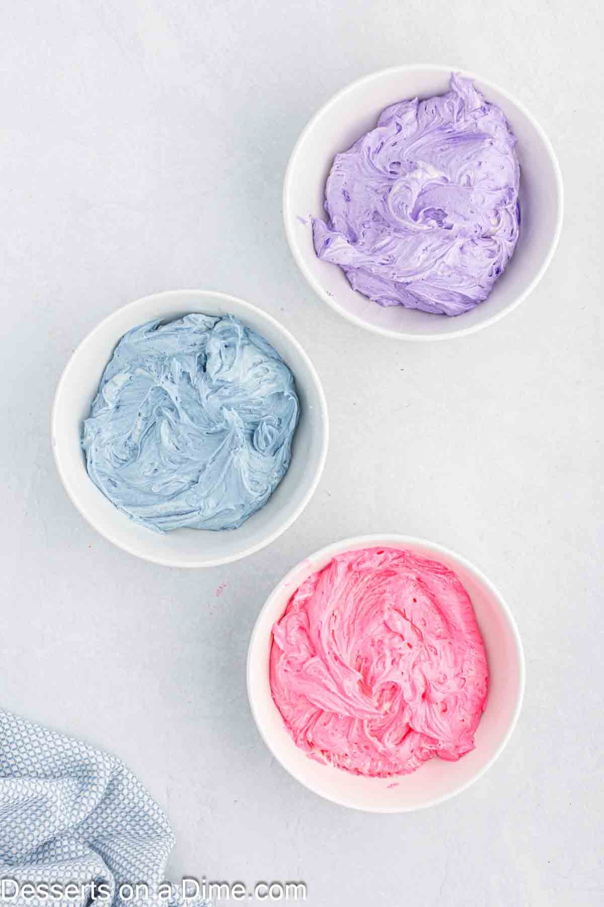 Frosting divided and food coloring added. 