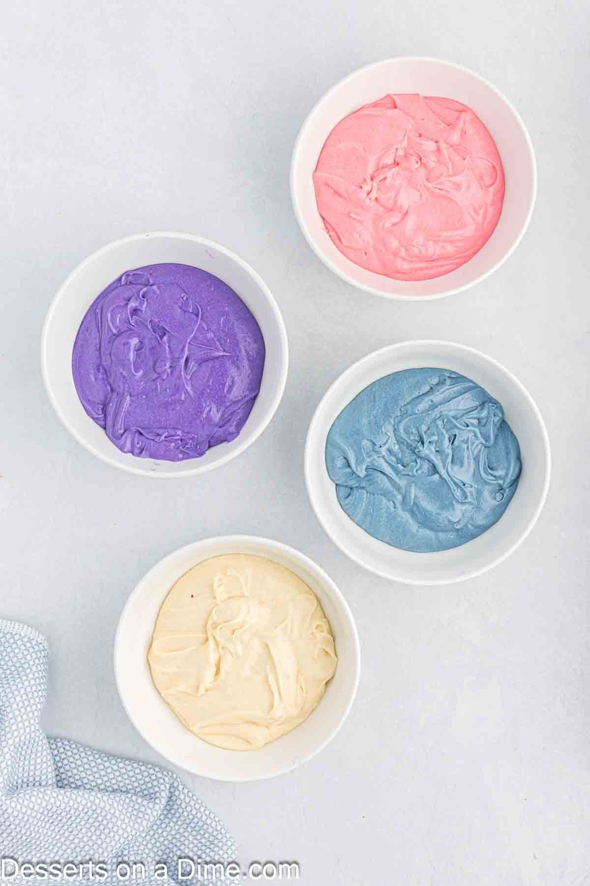 Batter divided into bowls and food coloring added. 