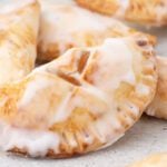 Air Fryer hand pies ready to enjoy and topped with glaze.