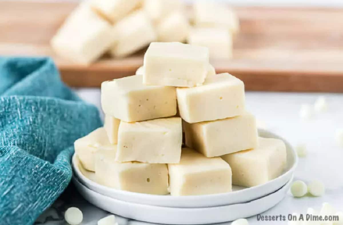 Vanilla fudge cut into squares and served on a platter.