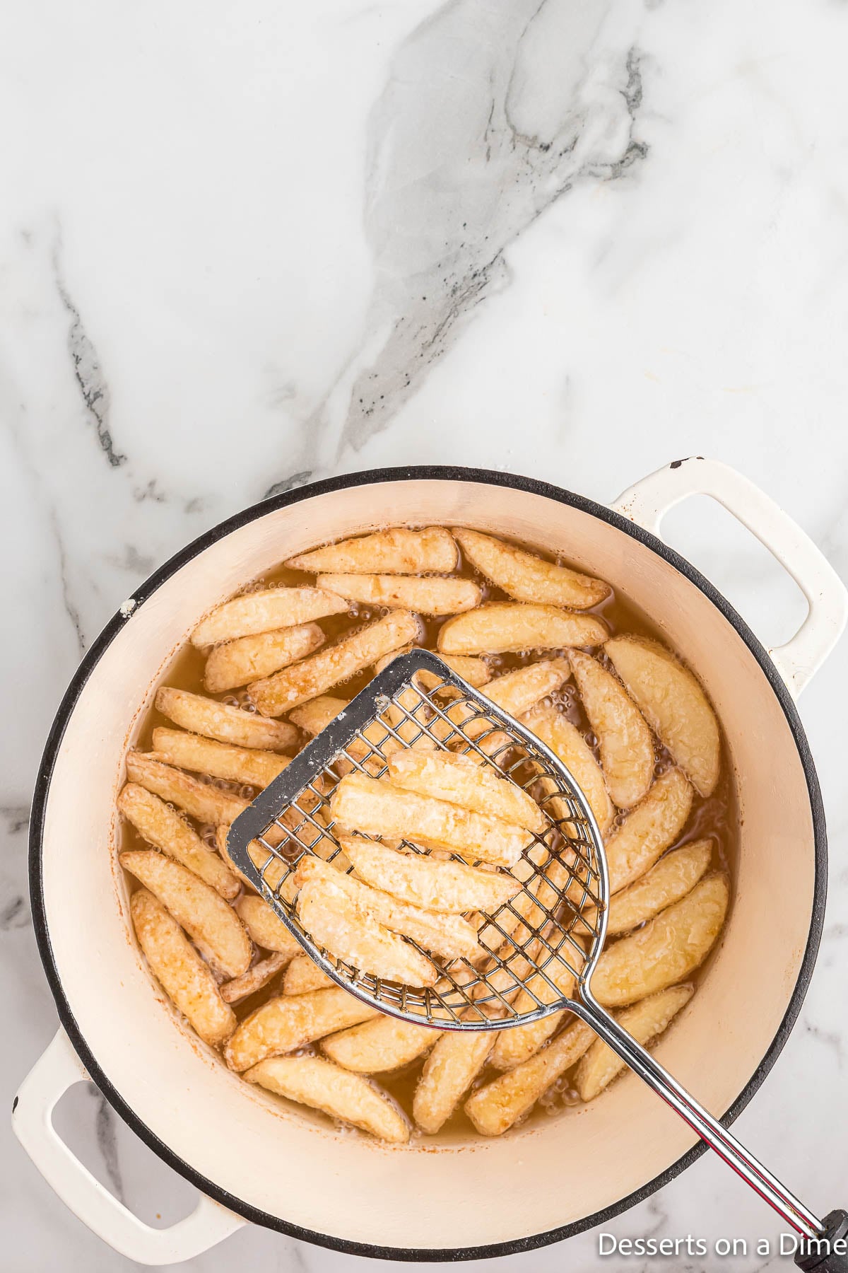 Apple Fries being turned over. 
