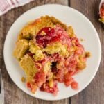 Cherry Pineapple Dump Cake on a white plate.