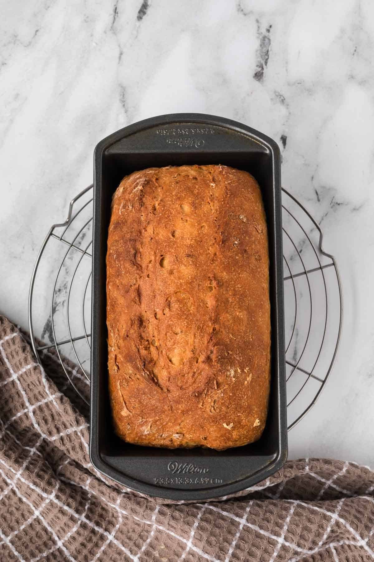 Bread baked and cooling on a wire rack. 