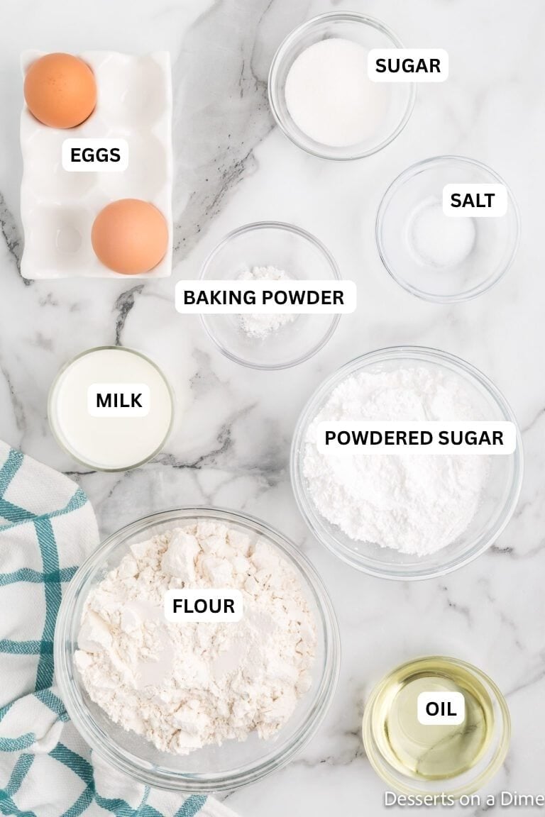 Ingredients for recipe: oil, flour, powdered sugar, milk, baking powder, salt, eggs and sugar. 