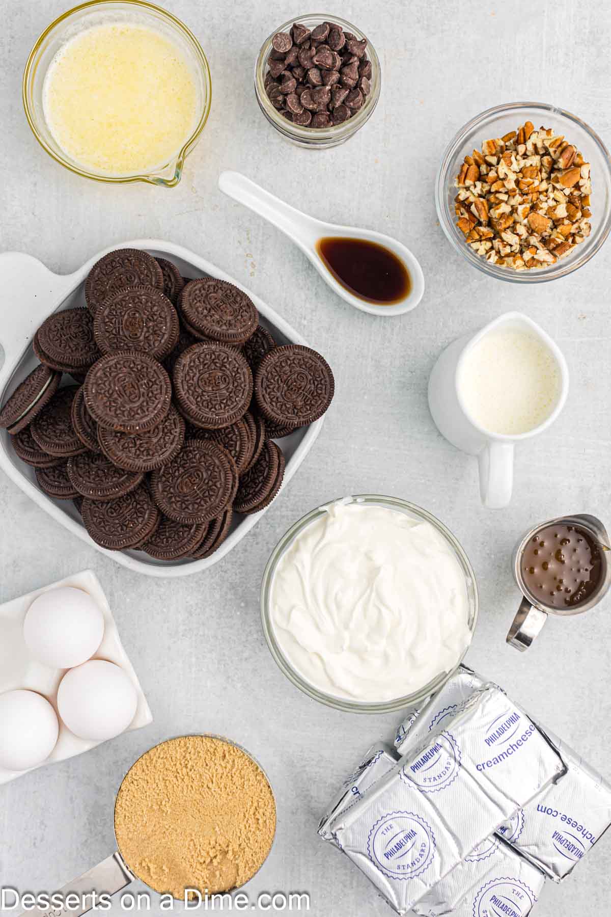 Ingredients for recipe - oreo cookies, butter, cream cheese, brown sugar, vanilla, sour cream, eggs, heavy cream. 