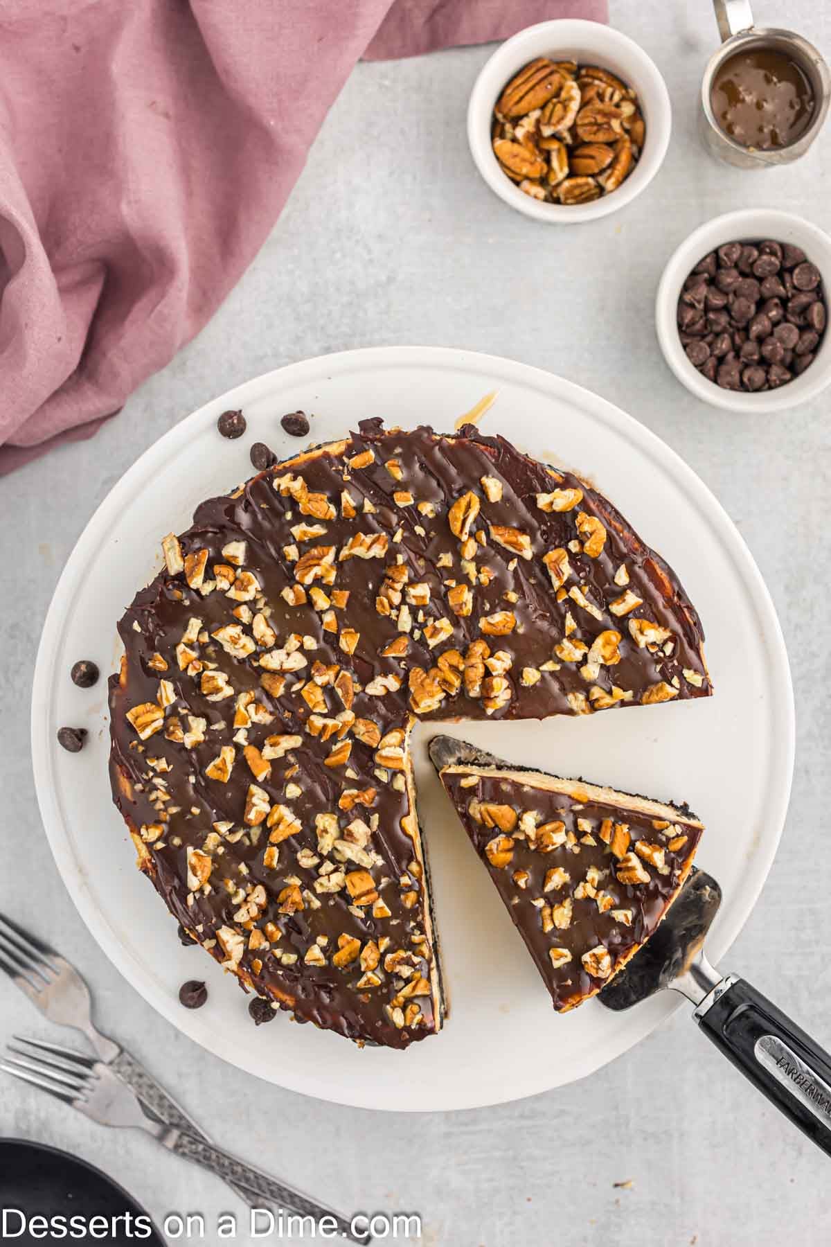 Cheesecake being sliced. 