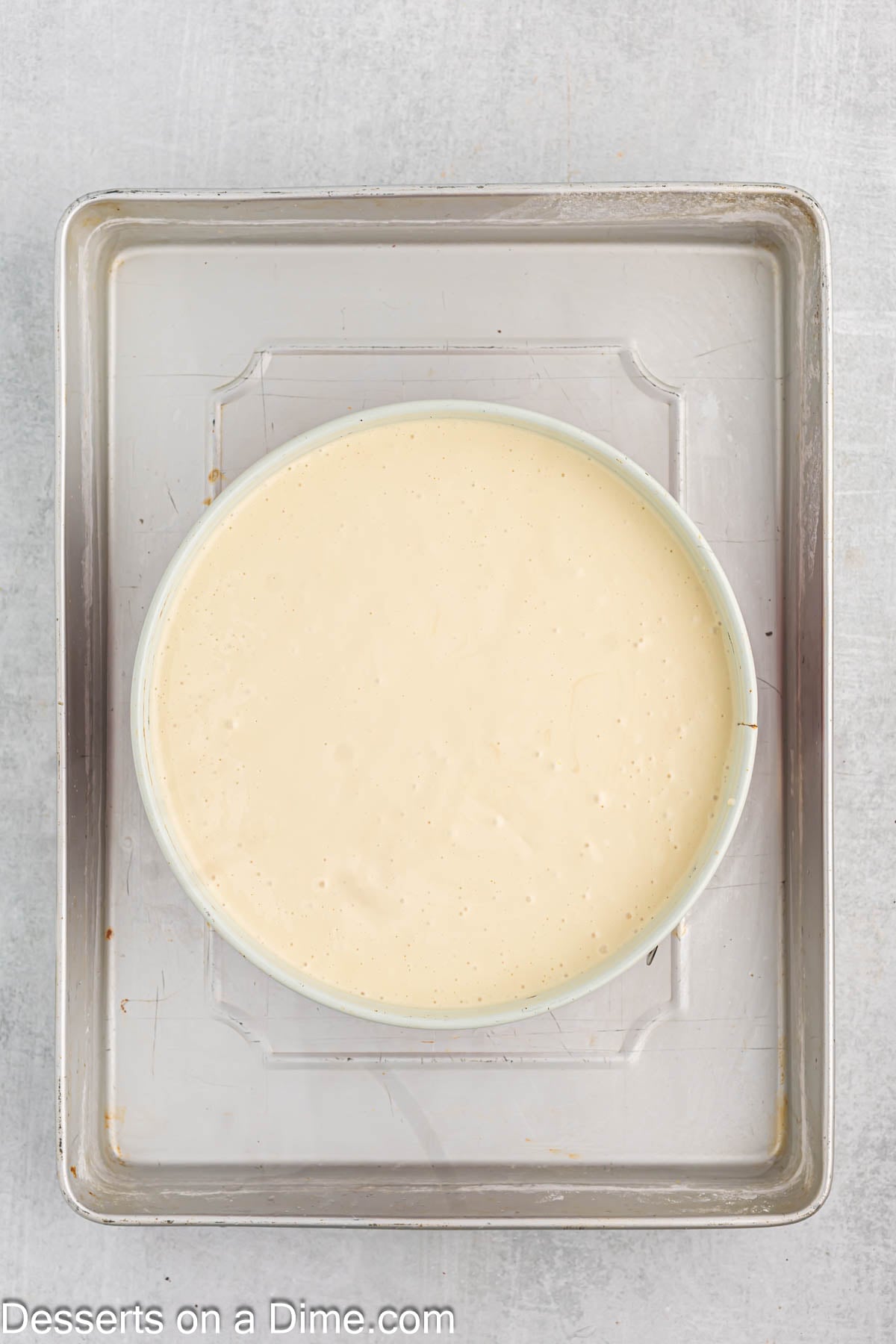 Filling poured into cheesecake pan. 