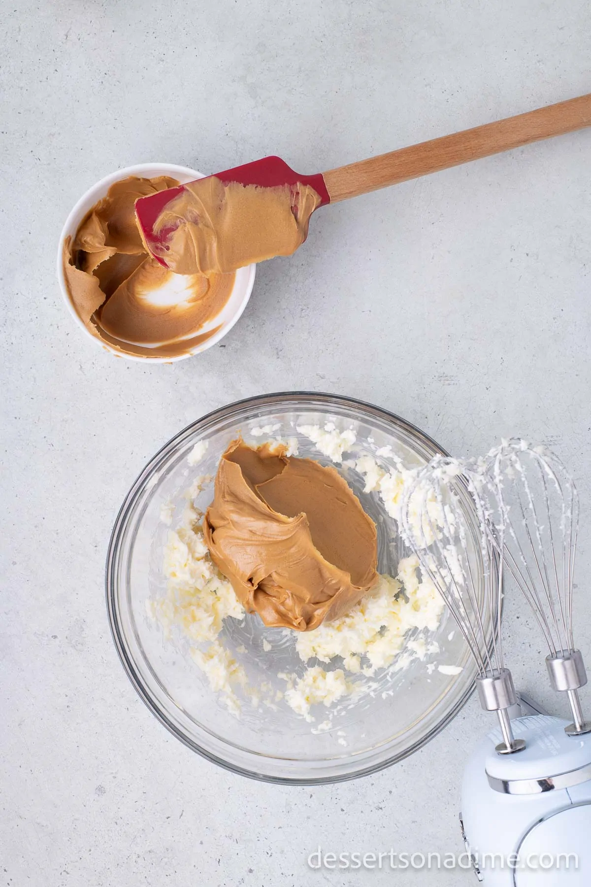 Mixing bowl with peanut butter and vanilla.