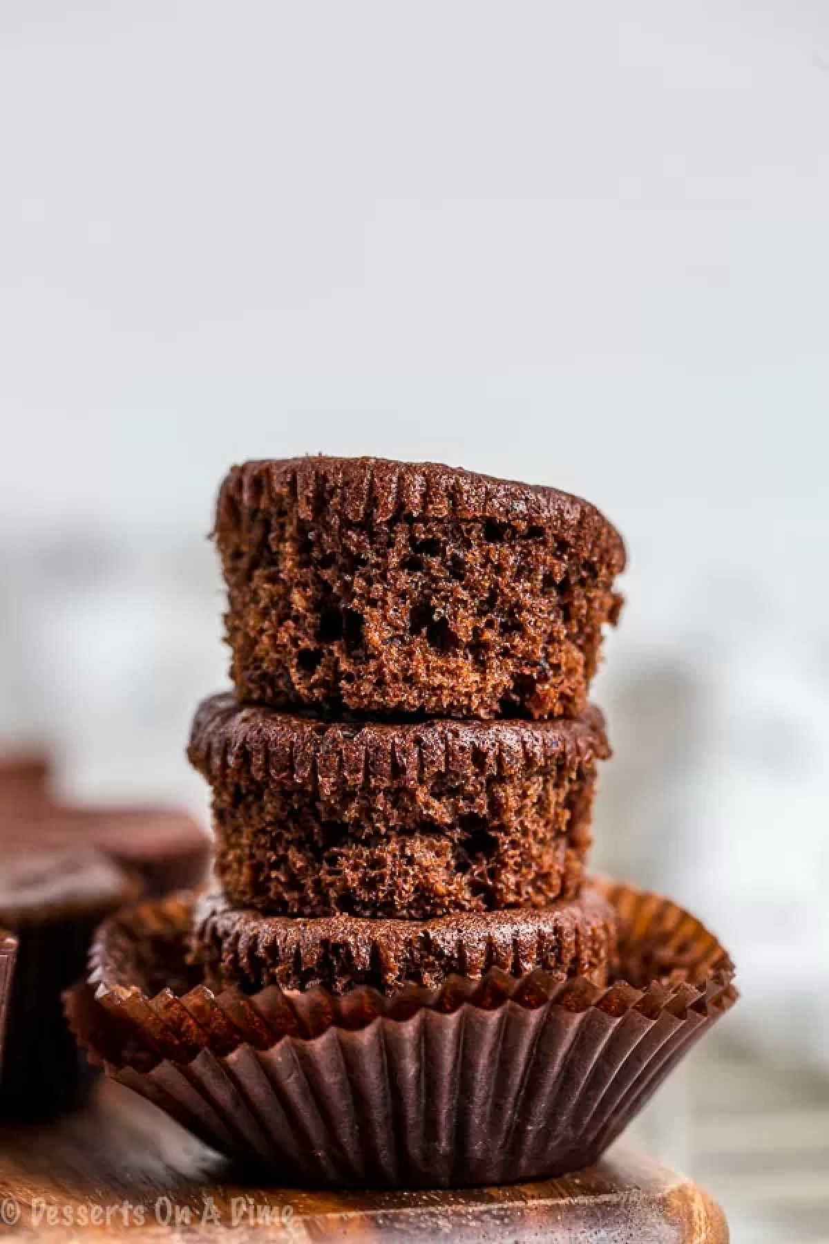 Close up image of keto brownie bites stacked. 