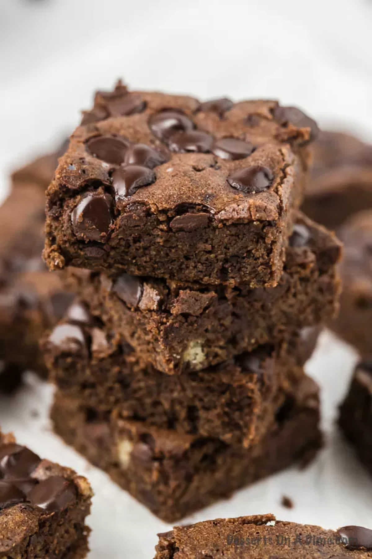 Keto brownies stacked together. 