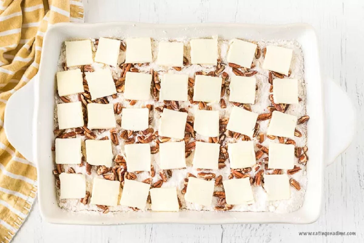 Slices of butter placed on cake. 