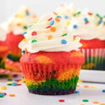 Rainbow cupcakes with rainbow sprinkles.