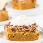 Pumpkin dump cake on a white plate.