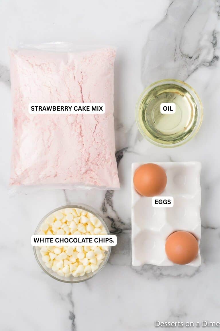 Ingredients for recipe: white chocolate chips, eggs, strawberry cake mix and oil. 