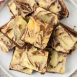 Squares of cream cheese brownies.