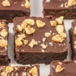 Little Debbie Brownies topped with nuts cut into squares.