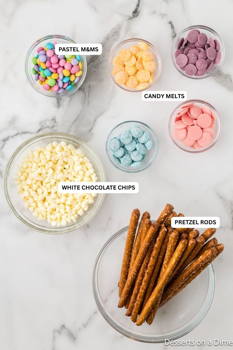 Ingredients for recipe: pastel M&M's, candy melts, white chocolate chips and pretzel rods. 
