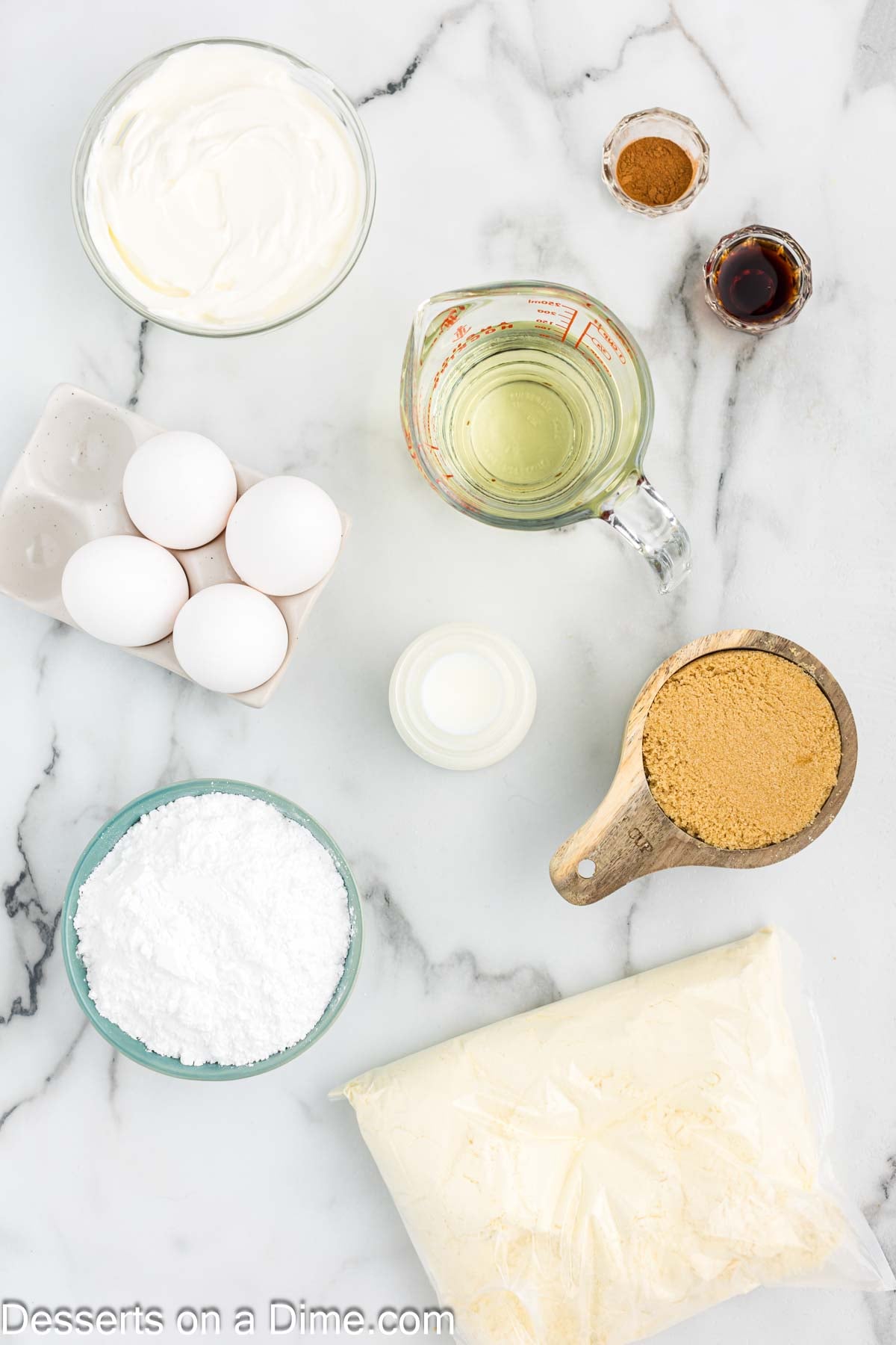 Ingredients for Honey Bun Cake - yellow cake mix, brown sugar, powdered sugar, sour cream, vanilla and milk. 