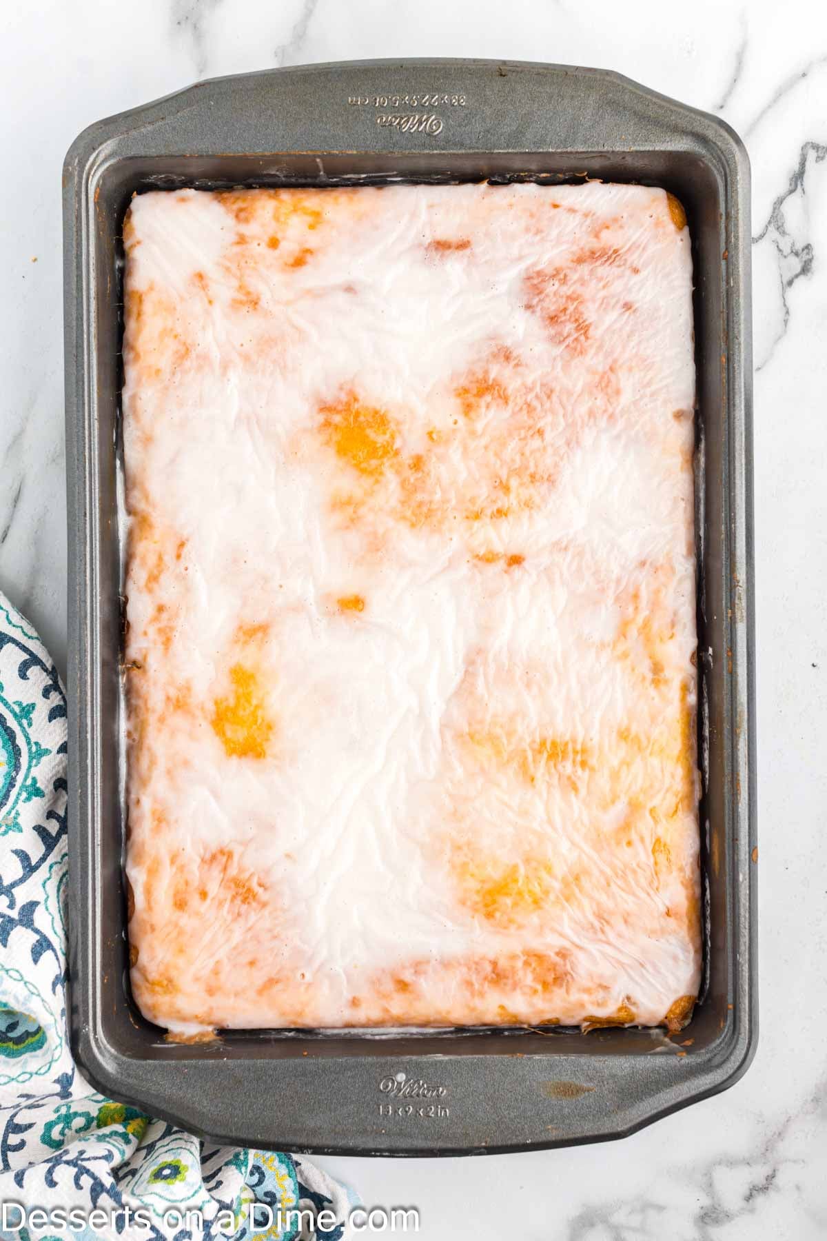 Glaze on cake waiting to set. 