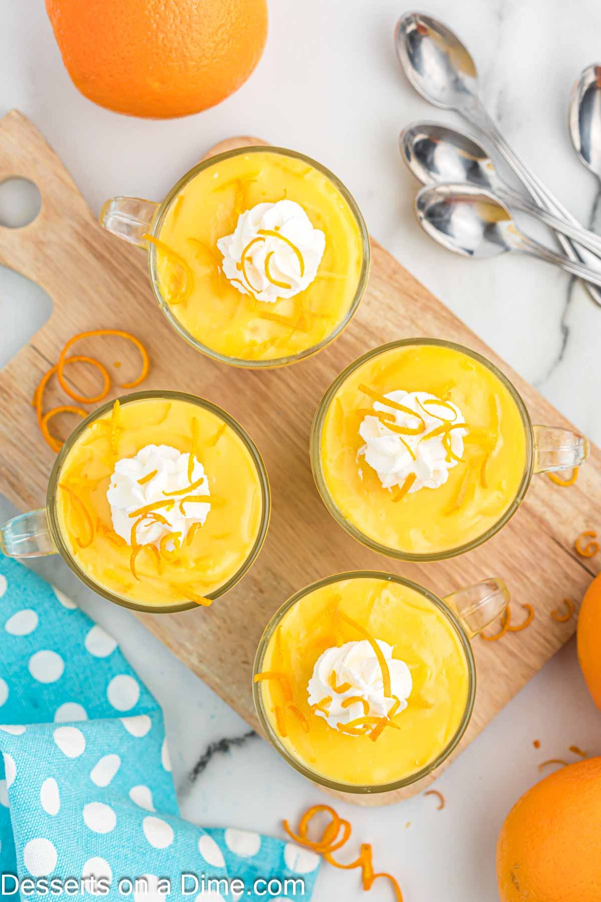 Whipped cream dolloped on each serving of pudding.