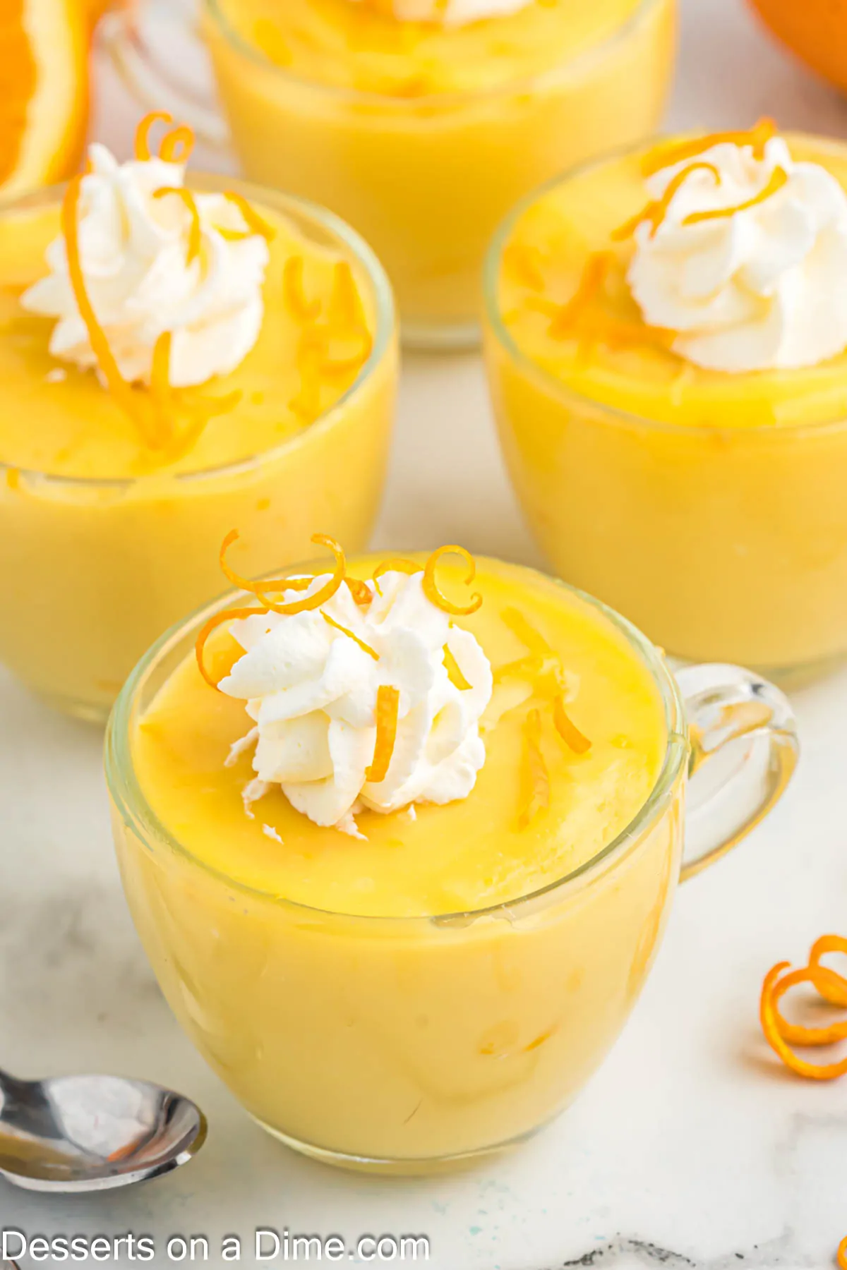 Pudding in cups with whipped cream.
