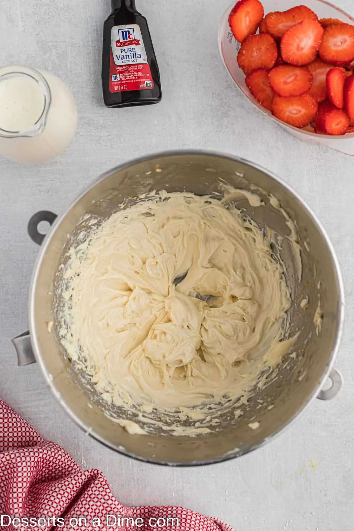 Cream cheese and sugar in a bowl.
