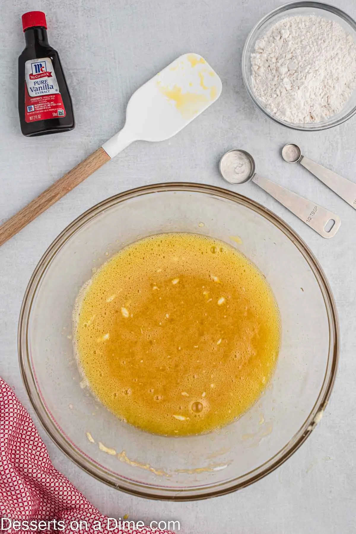 Mixing bowl with cake batter ingredients combined.