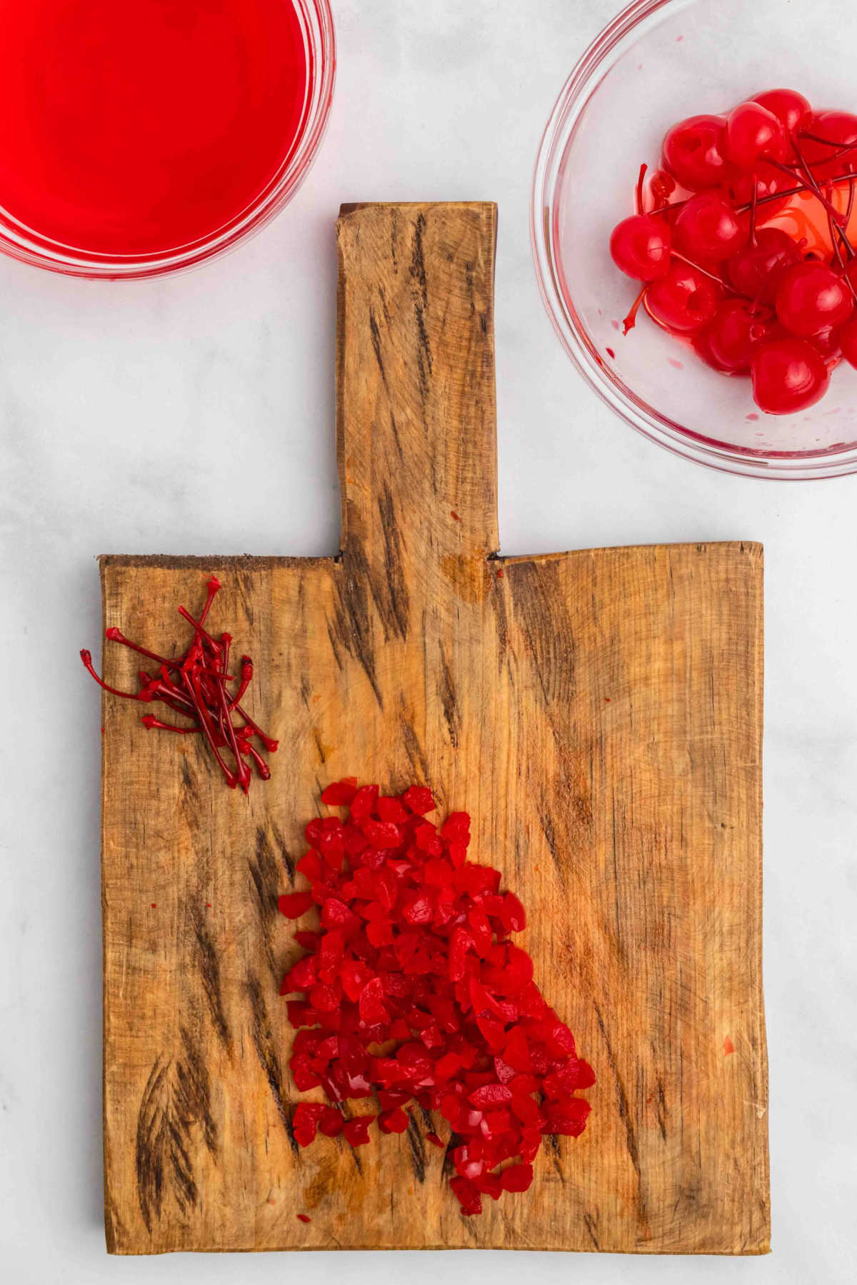 Cutting board with cherries.