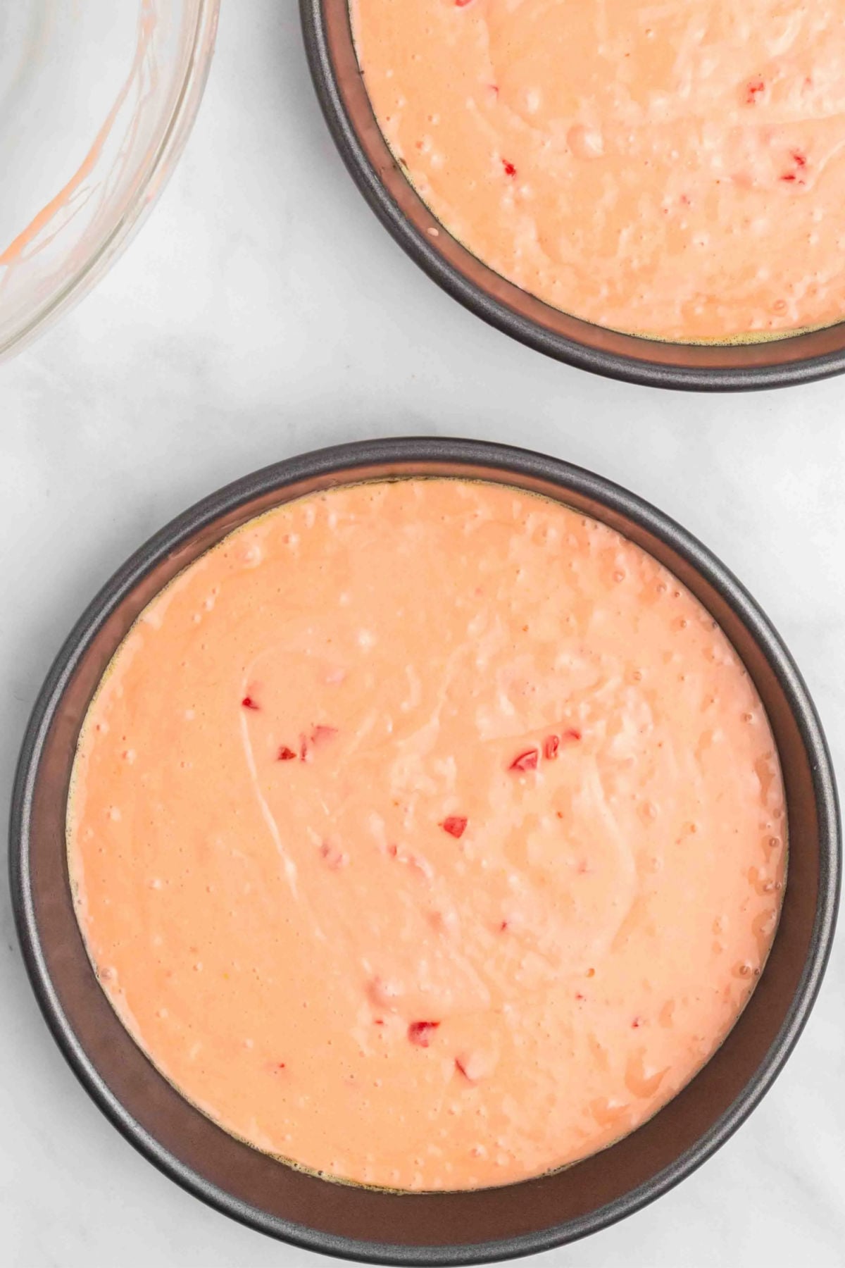 Batter poured into cake pans. 