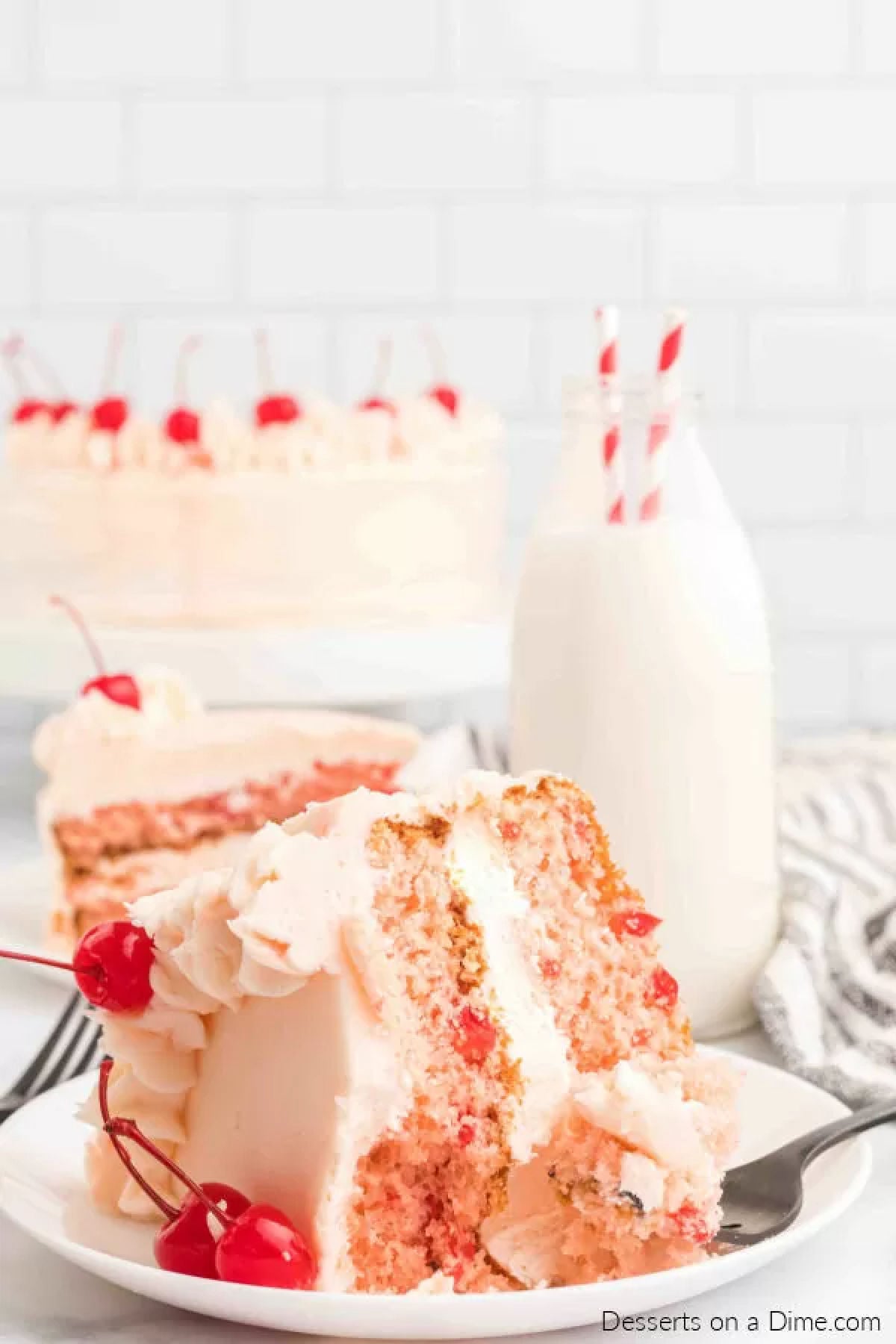 Slice of cherry chip cake on a plate. 