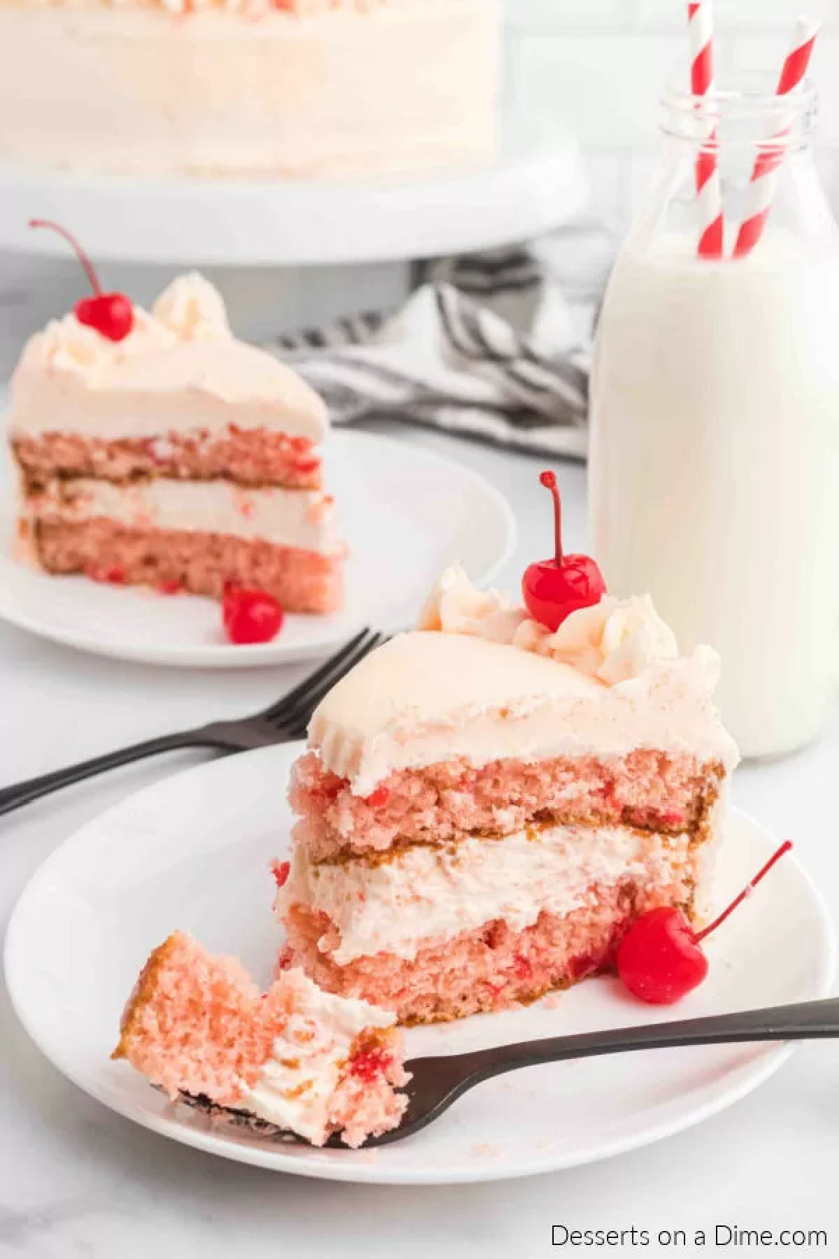 Slice of cherry chip cake on a plate. 