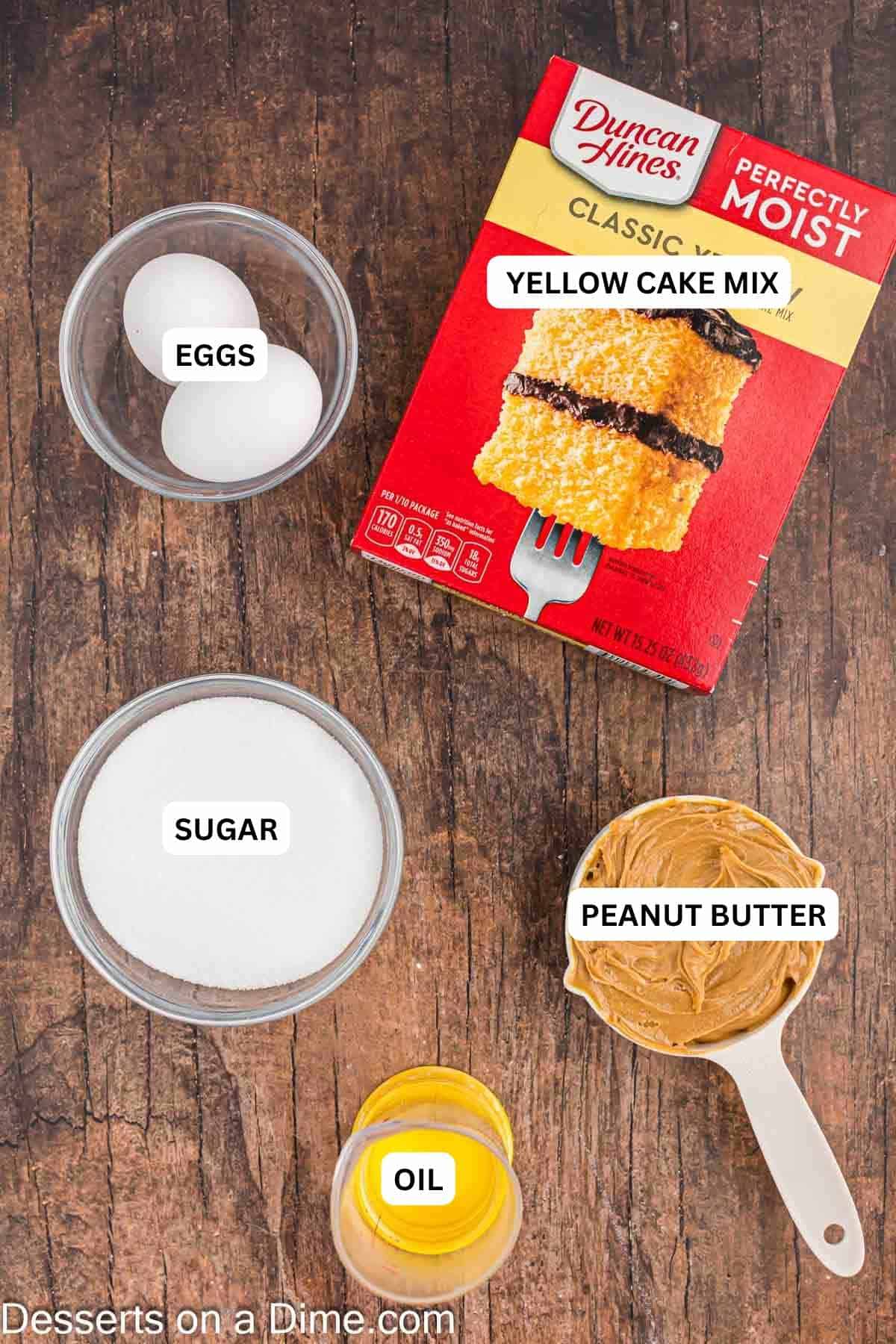 Ingredients for recipe: eggs, yellow cake mix, sugar, peanut butter and oil. 