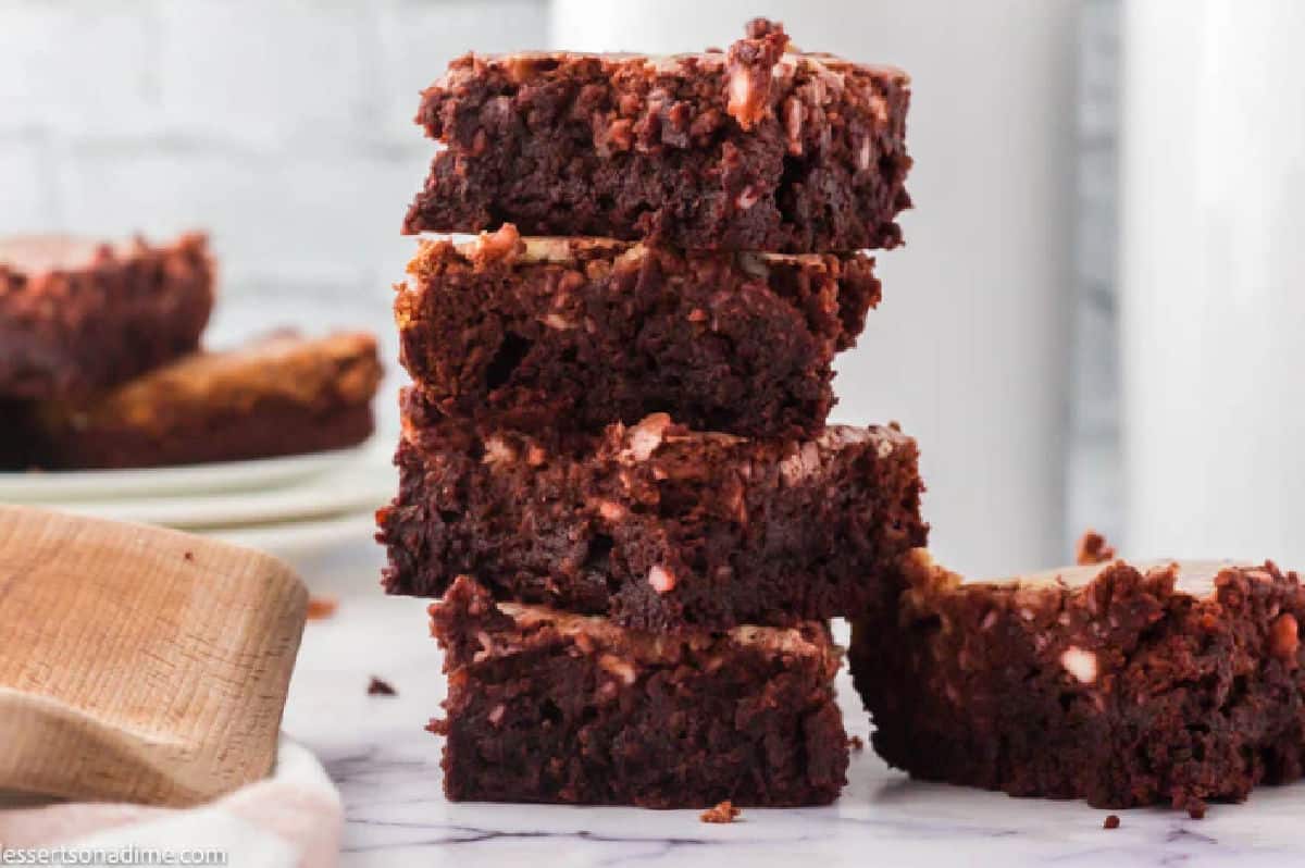 Red velvet brownies stacked together.