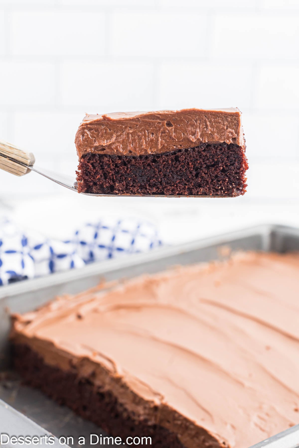 Chocolate mayonnaise cake being sliced. 