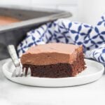 Chocolate mayonnaise cake cut and served on a plate.