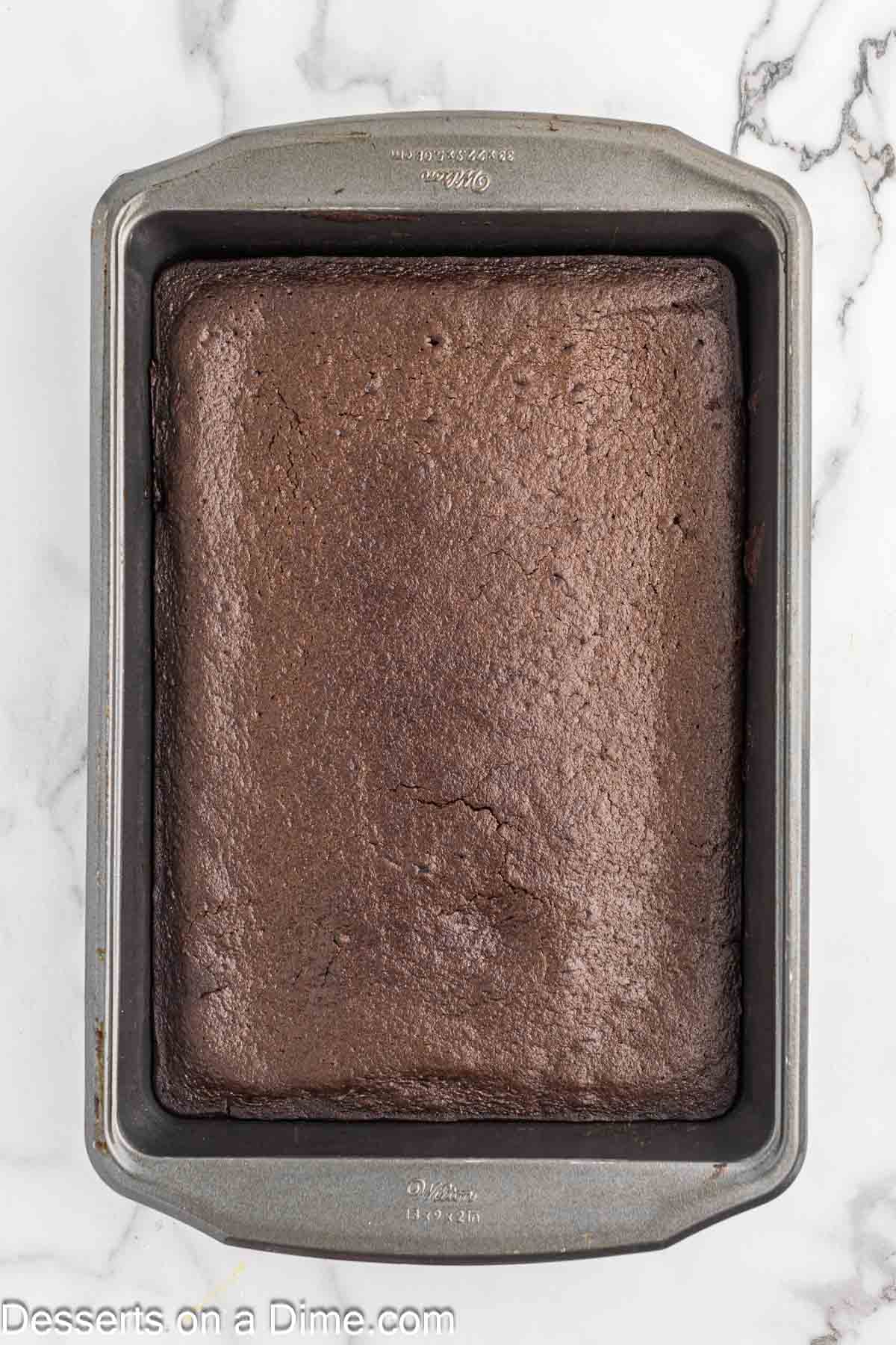 Cake baked and cooling in pan. 