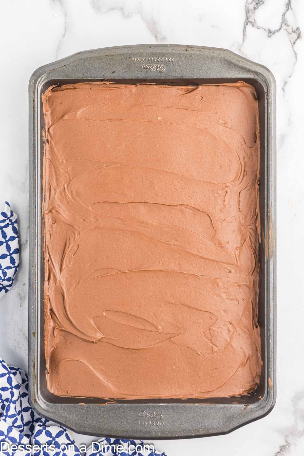 Frosting spread on top of cake. 