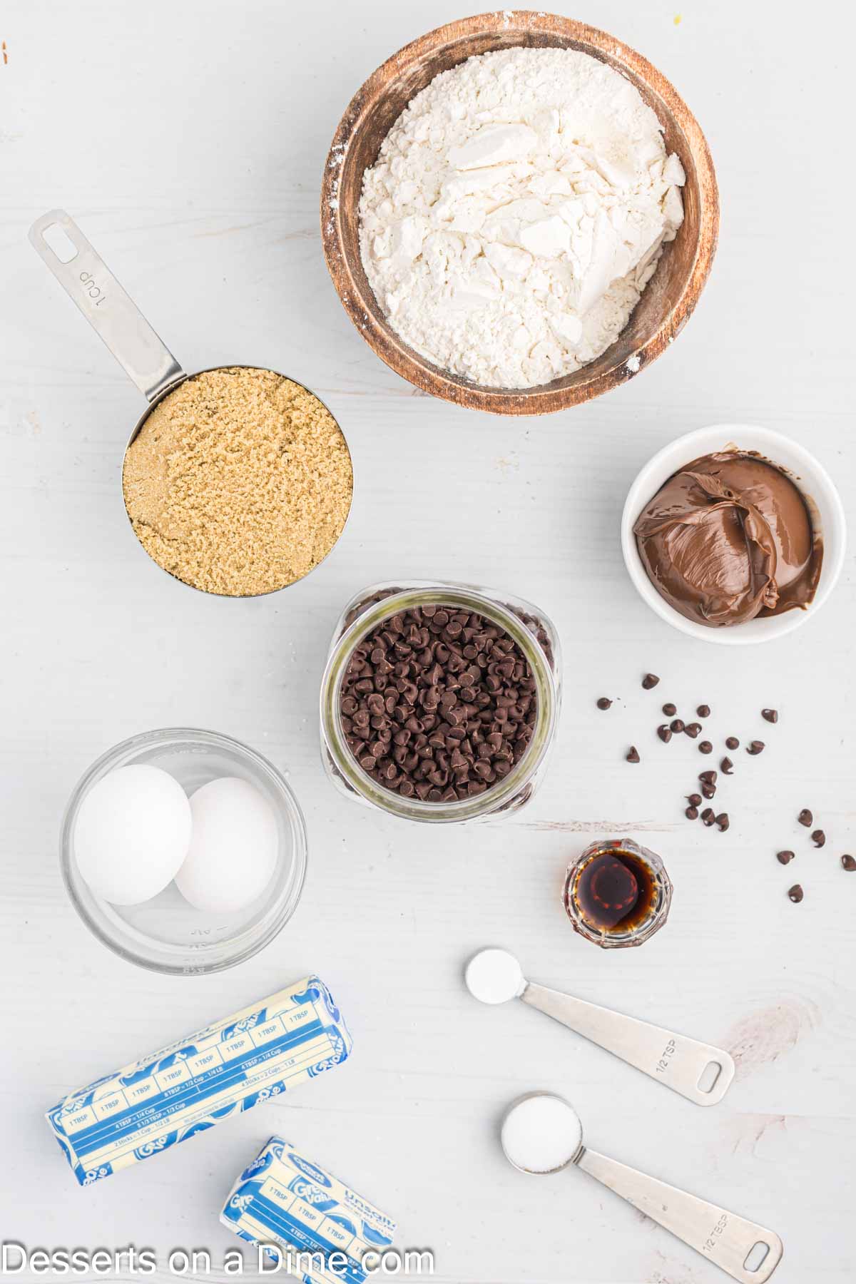 Ingredients for Nutella Bars - butter, brown sugar, eggs, vanilla, flour, chocolate chips, nutella. 