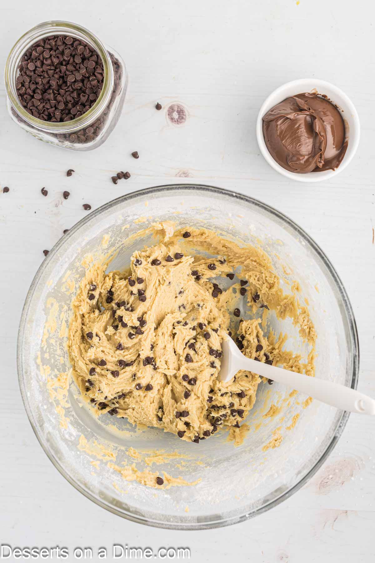 Chocolate chips folded into the bowl. 