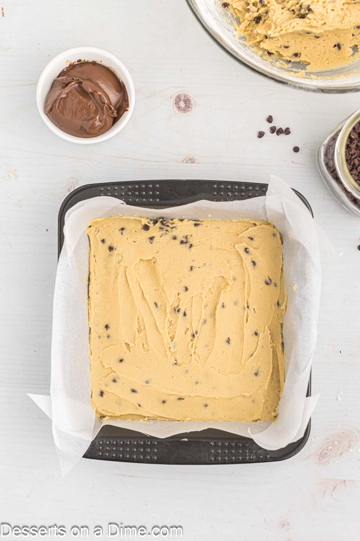Cookie dough spread into pan. 