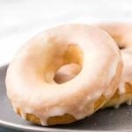 Glazed donuts on a plate.