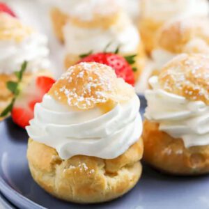 Cream Puffs served with berries.