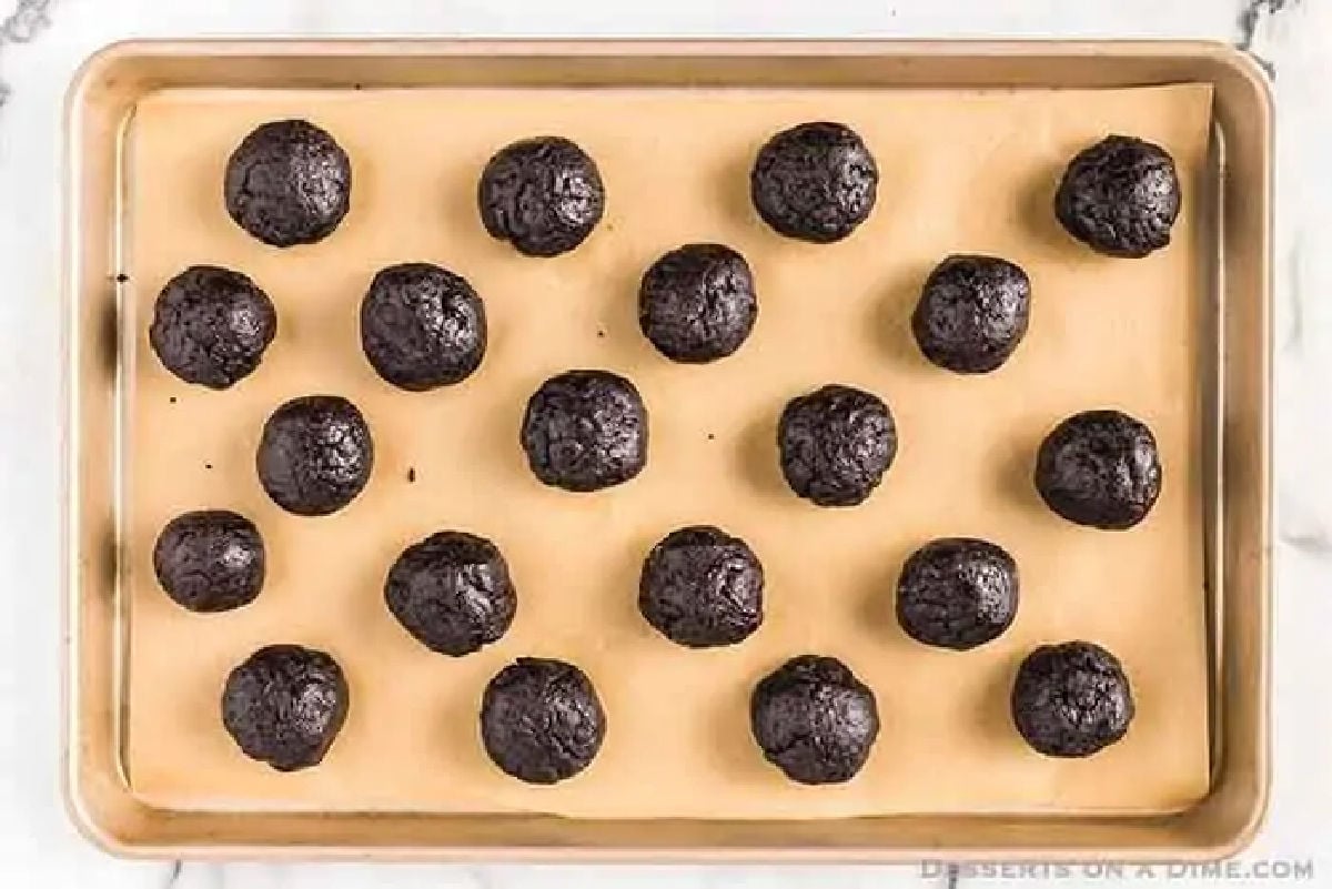 Oreo Balls on baking sheet ready to go in the freezer. 
