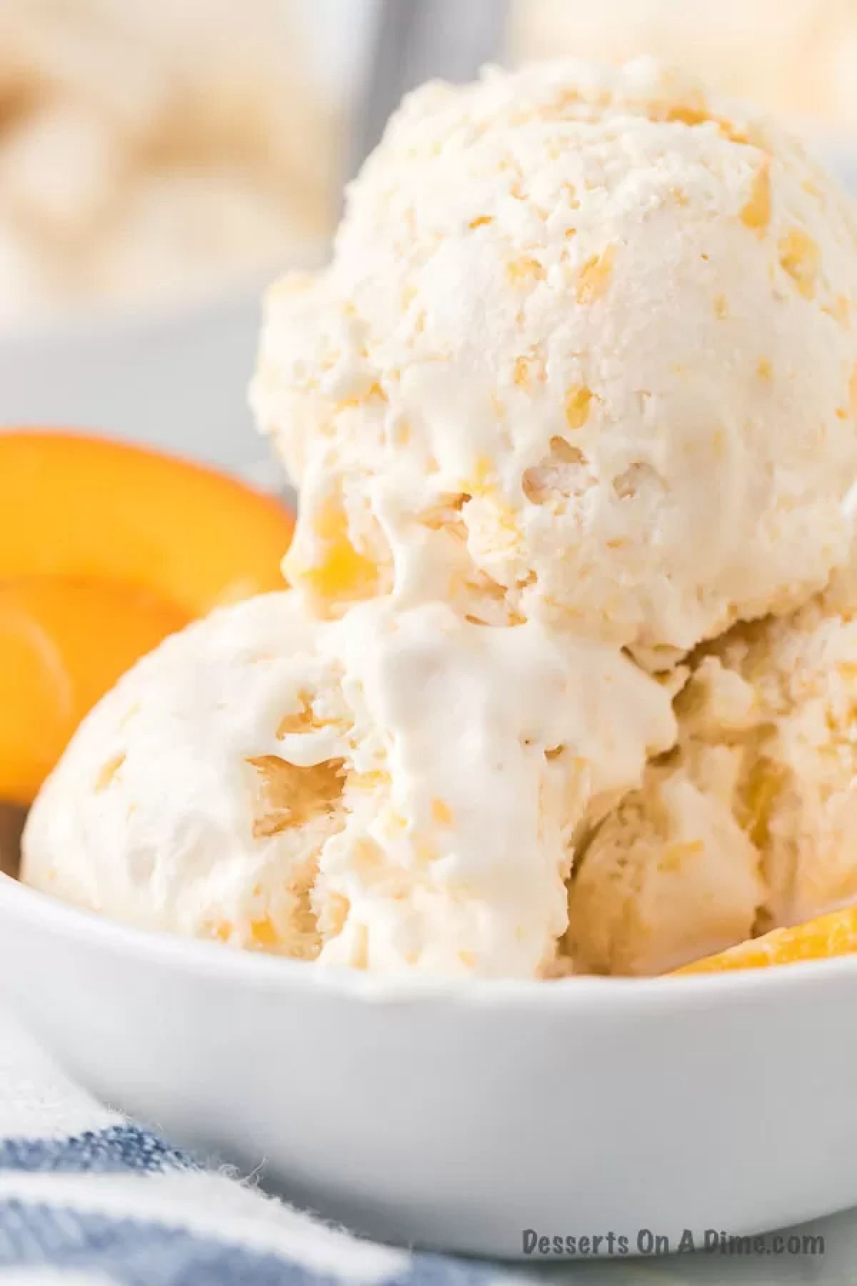 Peach ice cream in bowl. 