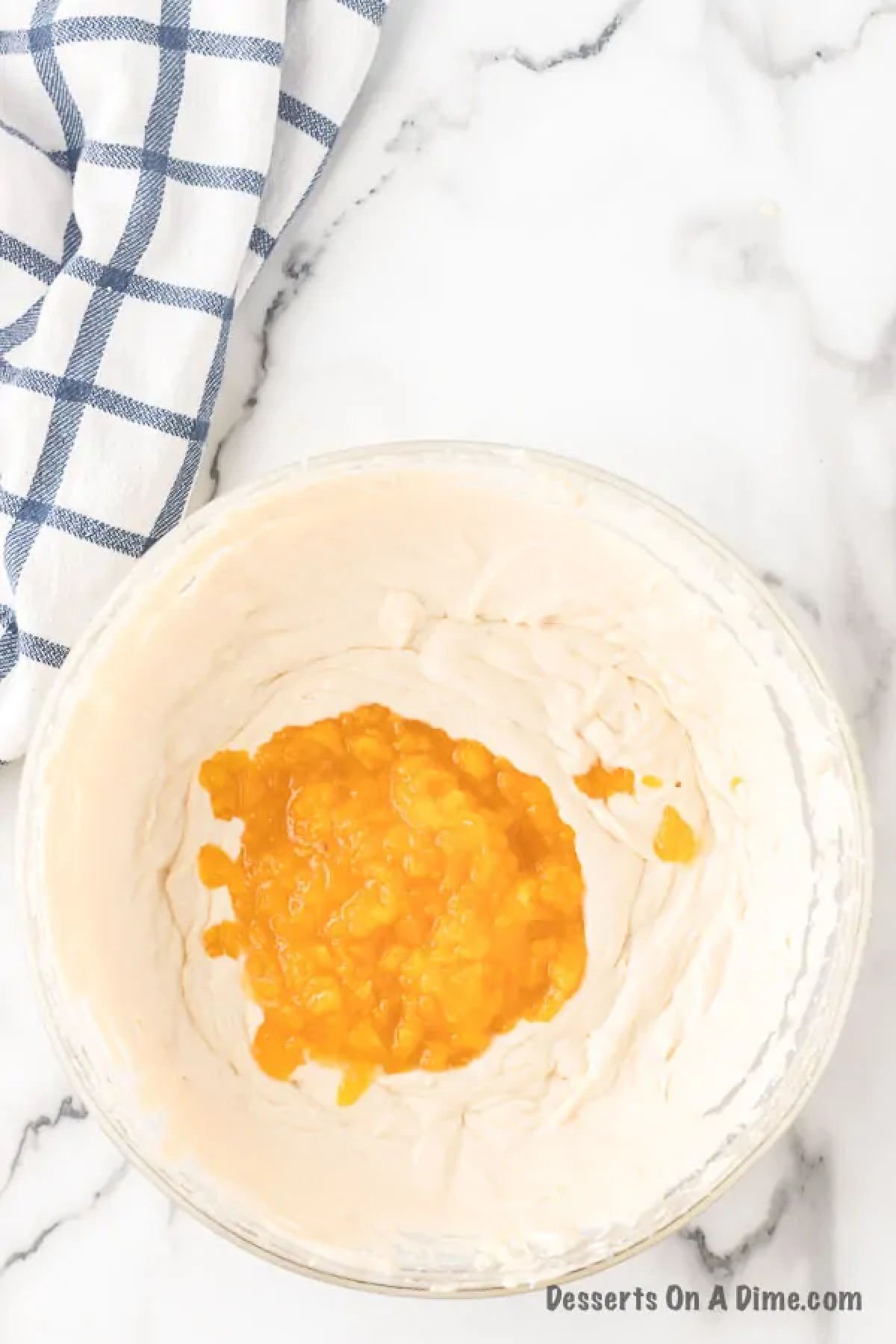 Peaches folded into ice cream base. 