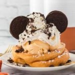 oreo funnel cake on a white plate ready to serve.