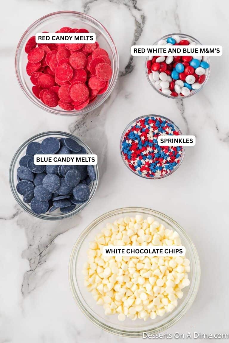 Ingredients for recipe: red candy melts, blue candy  melts, white chocolate chips, sprinkles and m&m's. 